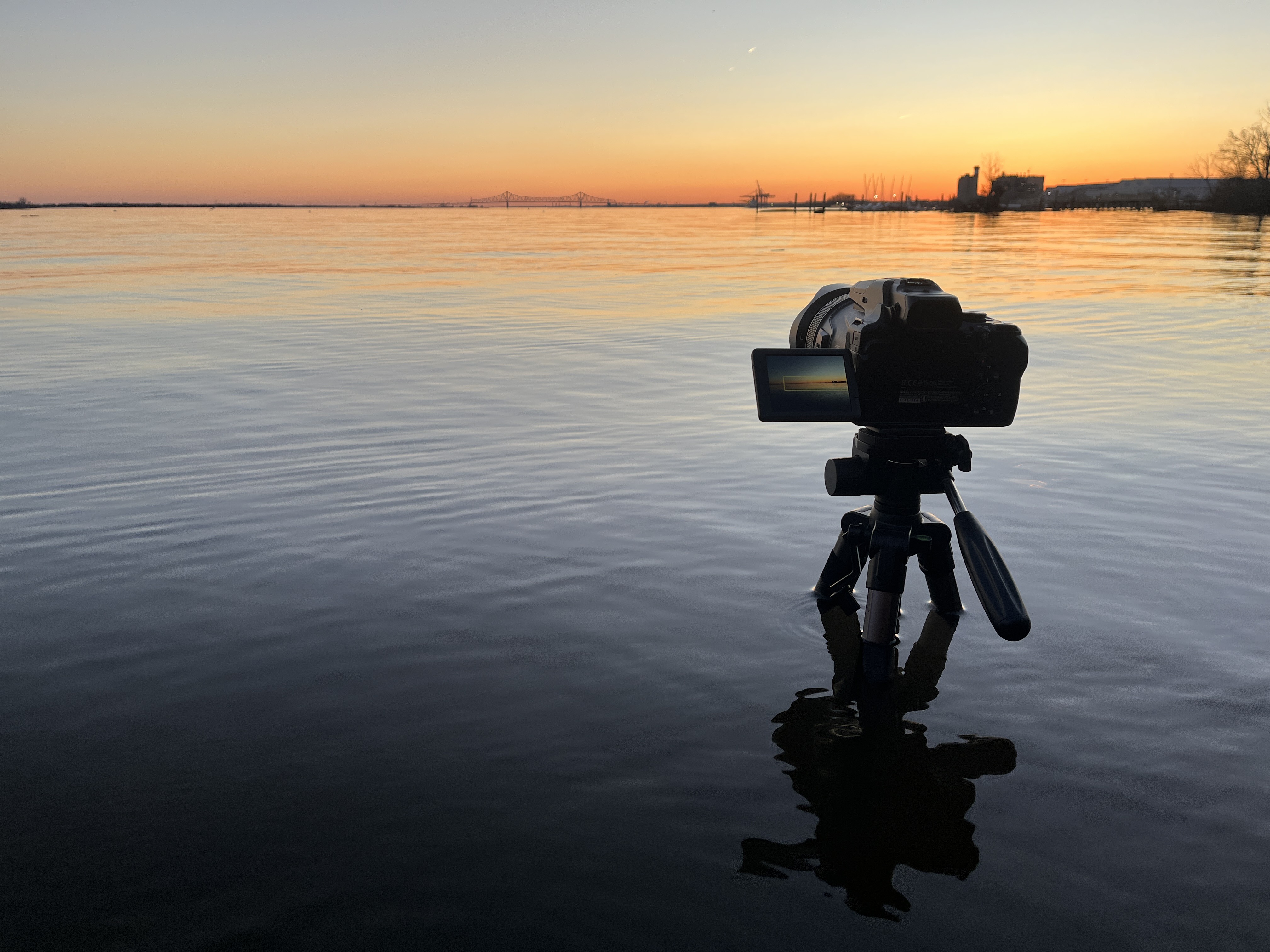P1000 camera on tripod in Printz Park sunset water