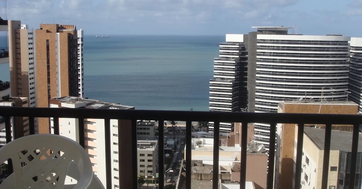 Coastal city balcony looking toward the ocean horizon